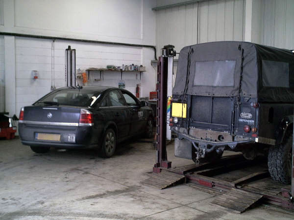 The MOT bay at Blossomgate Motors with a Land Rover on the test lift